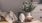 a vase with white flowers on a table