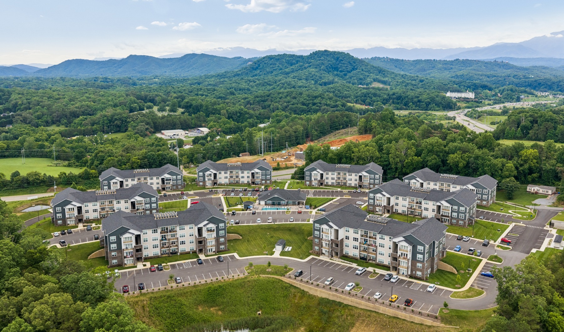 aerial view of community with mountains in background