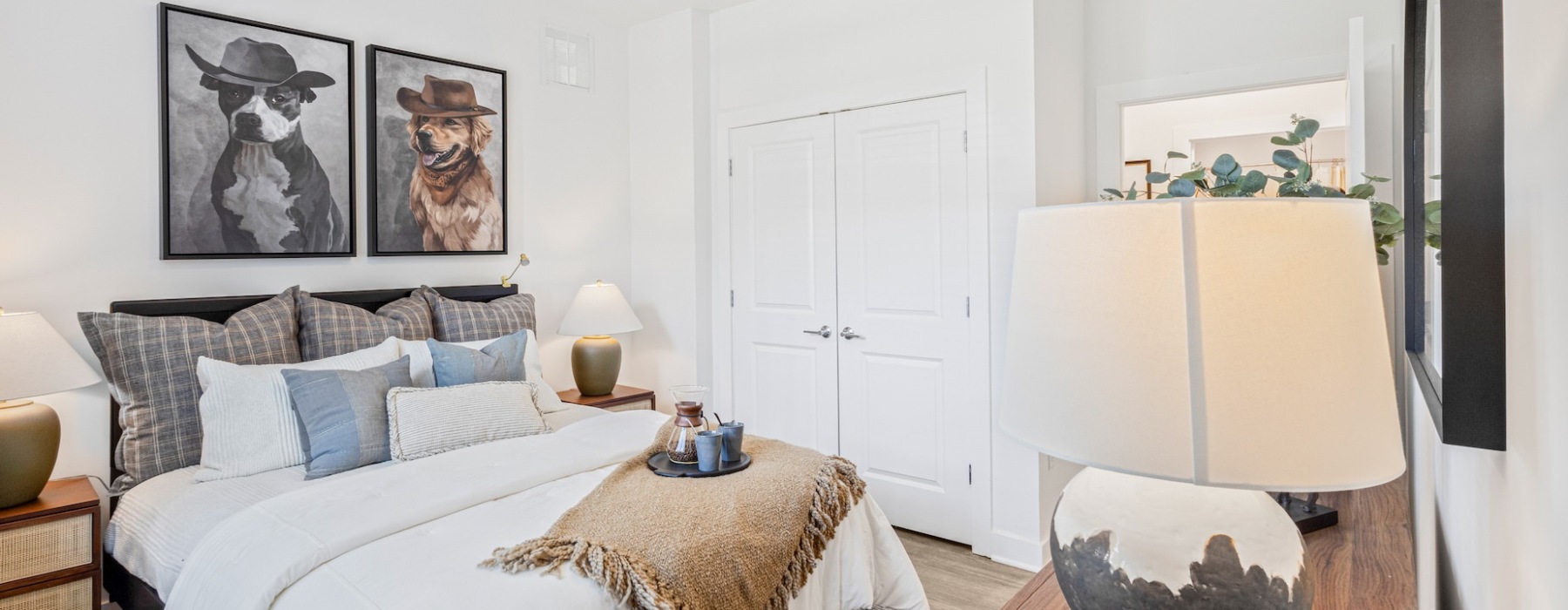 bed with dog paintings above