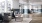 spacious lobby with tall windows and chairs