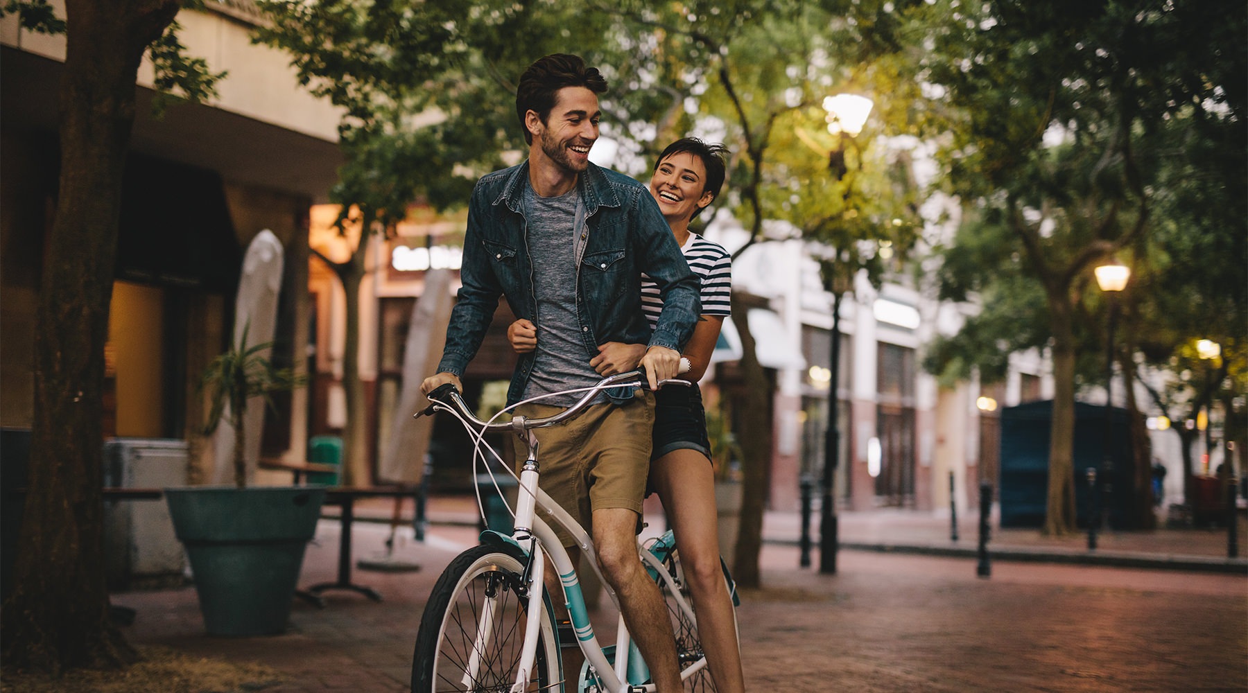 Live Fully in the Heart of Sevierville couple on a bike together